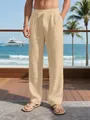 Men's loose breathable linen vacation pants with drawstring waist in a beige beach setting - Khaki
