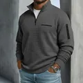 Détail du polo gris texturé à quart de zip pour homme avec poche zippée sur le bras - S / Hauts / Gris foncé