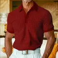Detail shot of men's red waffle-knit polo shirt showing fabric texture and placket - S / Tops / Burgundy