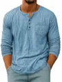 Detailed close-up of a men's light blue long-sleeved Henley shirt with a chest pocket. - S / Tops / Blue