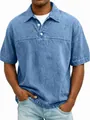 Detailed front view of men's light blue washed denim polo shirt featuring button closure - Blue