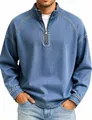 Macro view of vintage washed denim half-zip pullover showing collar and zipper details - Blue