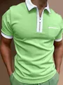 Close-up of men's slim fit green polo shirt with white zipper collar and chest pocket - S / Tops / Light Green