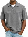 Macro detail showing the vintage washed texture and button placket of a grey polo shirt. - S / Tops / Gray