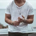 Detailed view of white lightweight men's t-shirt with breathable textured fabric - S / Tops / White