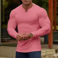 Detail view of men's pink ribbed long sleeve T-shirt showing texture and muscular fit - S / Tops / Pink