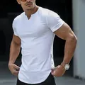 Macro view of men's white V-neck slim fit cotton T-shirt featuring a curved hem design - White