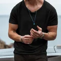 Close-up detail of men's dark grey slub cotton short sleeve t-shirt with deep V-neck. - S / Tops / Black