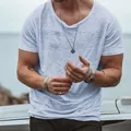Close-up of men's light blue slub cotton T-shirt showing fabric texture and relaxed fit - S / Tops / Blue