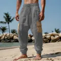 Detailed shot of men's gray cargo beach pants with contrasting tan side pockets - S / Bottoms / Gray