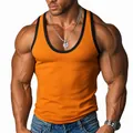Detailed view of men's orange ribbed athletic tank top with black contrast trim - S / Tops / Orange Red