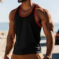 Close-up of black men's tank top with red trim on muscular athletic model outdoors - S / Tops / Black