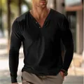 Close-up of black long-sleeve Henley shirt with buttoned V-neck on male model - S / Tops / Black