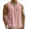 Detailed view of pink Henley fitness tank top for men with breathable textured fabric. - S / Tops / Pink