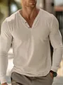 Detailed view of a slim fit men's long-sleeve Henley shirt with button neck detail - S / Tops / Apricot