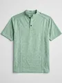 Detail view of men's green knit polo shirt with stand collar and button placket - Light Green