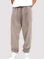 Detailed view of men's acid-wash drawstring sweatpants in a relaxed fit brown style - S / Bottoms / Khaki