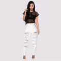 Detailed shot of white high-waisted ripped skinny jeans for a trendy summer look - S / Bottoms / White