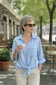 Casual light blue tie-front button-down shirt worn in outdoor cafe setting - S / Tops / Sky Blue