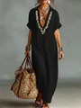Detailed view of women's black cotton linen maxi dress with wheat embroidery and lapel - S / Tops / Black
