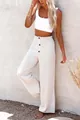 Full-length view of white high-waisted linen wide leg pants with elastic smocked waist - S / Bottoms / White