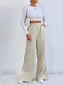 Detailed view of high-waisted beige corduroy casual pants with stylish slit hem design - Ivory