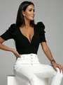 Detail view of a black slim fit V-neck blouse with elegant puff sleeves for women - S / Tops / Black