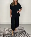 Elegant women's black plus size two-piece set with loose short sleeve top and wide pants - S / Top And Bottom / Black