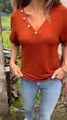 Detail view of burnt orange waffle knit V-neck T-shirt with decorative wooden buttons - M / Tops / Orange Red