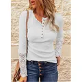 Detail of white long sleeve top featuring lace patchwork cuffs and button neckline. - S / Tops / White
