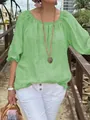 Close-up view of a light green cotton linen casual blouse with round neck and mid sleeves. - S / Tops / Green