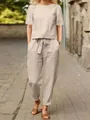 Elegante set in cotone e lino beige composto da camicetta a maniche corte e pantaloni larghi. - Taglia S / Top E Pantaloni / Albicocca