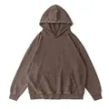 Close-up of vintage acid-wash brown oversized hoodie with front kangaroo pocket - S / Tops / Coffee