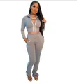 Women's stylish grey two-piece tracksuit set with a zip-up crop top and flared pants - S / Top And Bottom / Gray