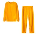 Set due pezzi arancione da donna con top a maniche lunghe e pantaloni coordinati - Giallo