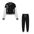 Two-piece set featuring a black and white cropped varsity jacket and matching sweatpants - S / Top And Bottom / Black