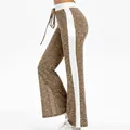Side view of casual wide-leg pants with white stripes and heathered brown print - S / Bottoms / Dark Gold