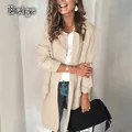 Close-up detail of a women's beige long-sleeved casual blazer with stylish faux pockets - Apricot
