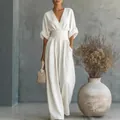 Elegant white V-neck cinched waist jumpsuit for women, minimalist studio background. - S / Top And Bottom / White