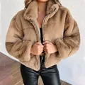 Detailed view of the plush texture and zipper on this brown faux fur jacket - XL / Tops / Khaki