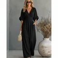 Elegant black V-neck wide-leg jumpsuit with cinched waist and puffed sleeves for women - Black