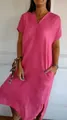 Close-up detail of a loose pink cotton linen dress showing V-neckline and short sleeves. - S / Rose Red