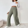 Sage green high-waisted ribbed knit wide-leg pants for women in a cozy lifestyle setting. - Yellow-Green