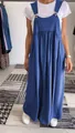 Front view of a blue cotton linen overall maxi dress styled with a white T-shirt - S / Bottoms / Blue