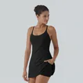 Black athletic dress detail showing built-in shorts pocket and ergonomic fit - Top And Bottom / XS / Black