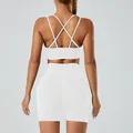 White seamless yoga set featuring a criss-cross back sports bra and high-waisted shorts - M / Top And Bottom / White