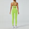 Neon green yoga set featuring a cross back sports bra and high waisted seamless leggings - M / Top And Bottom / Green