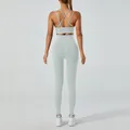 Mint green yoga set featuring a cross-back sports bra and high-waist fitness leggings - Grey Blue