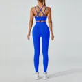 Two-piece royal blue yoga set with cross-back sports bra and high-waist leggings. - Blue
