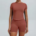 Two-piece seamless yoga set with round neck short sleeve top and shorts in rust brown color - XS / Top And Bottom / Shorts Set / Caramel Copper